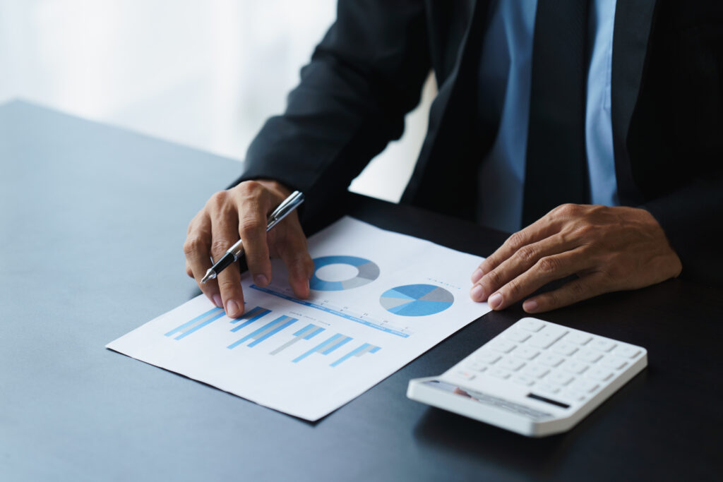 Businessmen working with graph data at office,Finance managers t